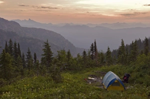 Blue tent and a vew of the North Cascade Mountains from the Tatoosh Wilderness adjacent Blue tent and a vew of the North Cascade Mountains from the Tatoosh Wilderness adjacent