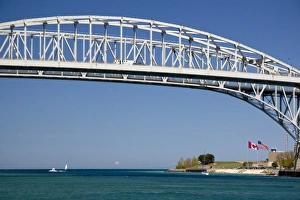 The Blue Water Bridge is a twin-span bridge that spans the St. Clair River between Port Huron The Blue Water Bridge is a twin-span bridge that spans the St. Clair River between Port Huron