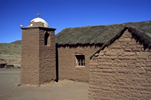 Bolivia, San Antonio, Bell tower on a mud brick church Bolivia, San Antonio, Bell tower on a mud brick church