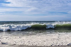 Breaking wave on a beach in northern California Breaking wave on a beach in northern California
