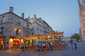 A cafe on the place pey berland in Bordeaux, outside seating terrasse lit by electric A cafe on the place pey berland in Bordeaux, outside seating terrasse lit by electric