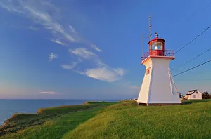 Canada, New Brunswick, Cap Lumiere. Richibucto Head Lighthouse and ocean. Credit as Canada, New Brunswick, Cap Lumiere. Richibucto Head Lighthouse and ocean. Credit as
