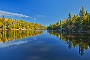 Canada, Ontario. Forest reflections on Blindfold Lake in autumn Canada, Ontario. Forest reflections on Blindfold Lake in autumn