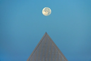 Canada, Ontario, St. Catharines. Full moon and triangular-shaped roof at Brock University Canada, Ontario, St. Catharines. Full moon and triangular-shaped roof at Brock University