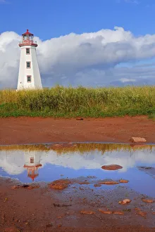 Canada, Prince Edward Island, North Cape. North Point Lighthouse reflects in pool Canada, Prince Edward Island, North Cape. North Point Lighthouse reflects in pool