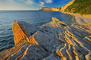Canada, Quebec, Forillon National Park. Limestone along Atlantic shoreline at sunrise Canada, Quebec, Forillon National Park. Limestone along Atlantic shoreline at sunrise