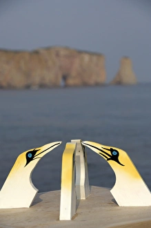 Canada, Quebec, Perce. Wooden gannets with view of St. Lawrence River & Perce Rock in Canada, Quebec, Perce. Wooden gannets with view of St. Lawrence River & Perce Rock in