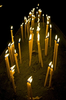 Candles burning in the Armenian orthodox church at Geghard monastery near Garni Candles burning in the Armenian orthodox church at Geghard monastery near Garni