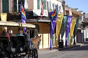 Carriage rides in the Mardi Gras decorated French Quarter, New Orleans, Louisiana Carriage rides in the Mardi Gras decorated French Quarter, New Orleans, Louisiana