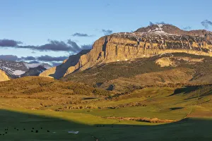 Cattle pastures below Walling Reef at sunrise near Dupuyer, Montana, USA Cattle pastures below Walling Reef at sunrise near Dupuyer, Montana, USA