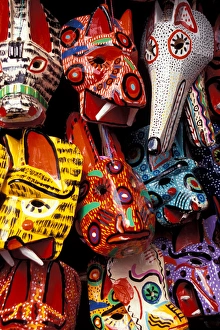 Central America, Guatemala, Highlands, Chichicastenango, painted masks at Sunday market Central America, Guatemala, Highlands, Chichicastenango, painted masks at Sunday market