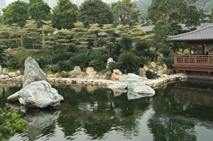 China, Hong Kong, New Territoris. Nan Lian Garden, Blue Pond & rock garden China, Hong Kong, New Territoris. Nan Lian Garden, Blue Pond & rock garden