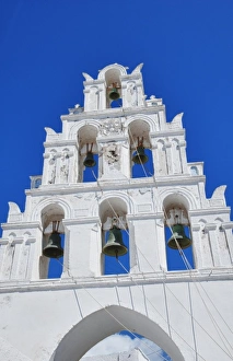 Church with bells in small traditional village near Kamari in Santorini in Greek Islands Church with bells in small traditional village near Kamari in Santorini in Greek Islands