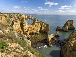 The cliffs and sea stacks of Ponta da Piedade at the rocky coast of the Algarve in Portugal The cliffs and sea stacks of Ponta da Piedade at the rocky coast of the Algarve in Portugal