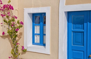 Close up of doorway and flowers in Santorini Greece in Greek Islands Close up of doorway and flowers in Santorini Greece in Greek Islands