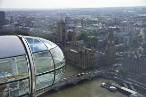 A close up shot of the glass capsule on the London Eye as it passes Parliment and Big Ben A close up shot of the glass capsule on the London Eye as it passes Parliment and Big Ben