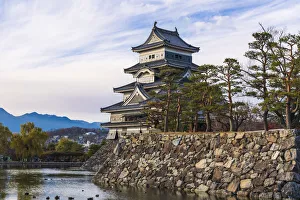 Closeup of the Matsumoto Castle in the golden light of the evening sun, Japan Closeup of the Matsumoto Castle in the golden light of the evening sun, Japan