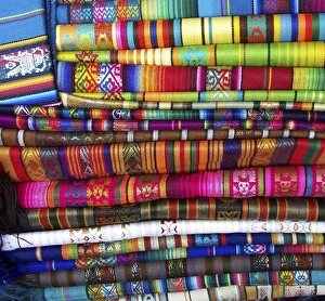 Colorful blankets at indigenous market in Pisac, Peru in the Sacred Valley Colorful blankets at indigenous market in Pisac, Peru in the Sacred Valley