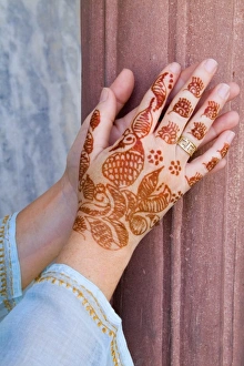Colorful Henna design on womans hands artwork for celebration tatoos in Delhi India (MR) Colorful Henna design on womans hands artwork for celebration tatoos in Delhi India (MR)