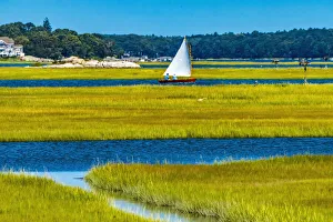 Colorful sailboat, Westport, Massachusetts. Osprey nests, marshland Colorful sailboat, Westport, Massachusetts. Osprey nests, marshland