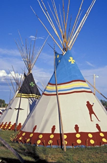 Colorfully painted with decorative designs on Blackfeet tepees made from canvas stretched Colorfully painted with decorative designs on Blackfeet tepees made from canvas stretched