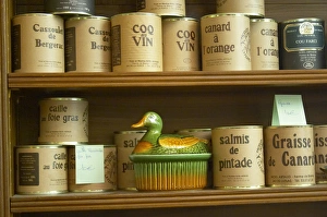 Conserve cans with different kinds of duck specialities Cassoulet de Bergerac, Coq au vin Conserve cans with different kinds of duck specialities Cassoulet de Bergerac, Coq au vin
