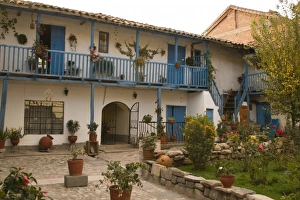 Courtyard with blue railing and many flower pots, Cuzco, Peru Courtyard with blue railing and many flower pots, Cuzco, Peru