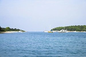 Cres, Coatia - Boats floating in an ocean inlet. Horizontal shot Cres, Coatia - Boats floating in an ocean inlet. Horizontal shot