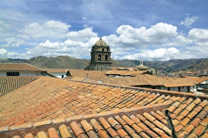 Cusco, Peru, red tiled rooftops and the Cusco Cathedral and mountains Cusco, Peru, red tiled rooftops and the Cusco Cathedral and mountains