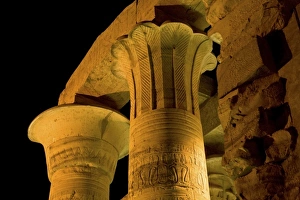 Egypt, Kom Ombo. Illuminated pillars of Kom Ombo Temple dedicated to two Egyptian gods Egypt, Kom Ombo. Illuminated pillars of Kom Ombo Temple dedicated to two Egyptian gods