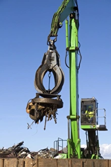 Electromagnetic crane lifting scrap steel for recycling at the Pacific Steel Electromagnetic crane lifting scrap steel for recycling at the Pacific Steel
