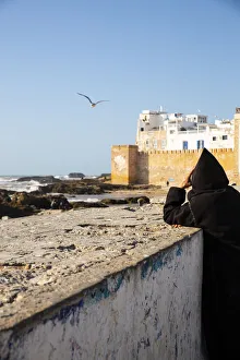 Essaouira, Morocco. Watching the sea and a seagull Essaouira, Morocco. Watching the sea and a seagull