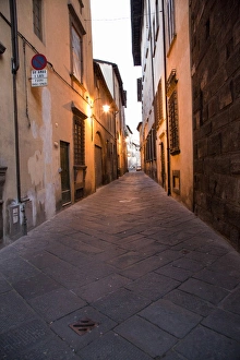 Europe; Italy; Lucca; Back Alley as evening Lights come Europe; Italy; Lucca; Back Alley as evening Lights come