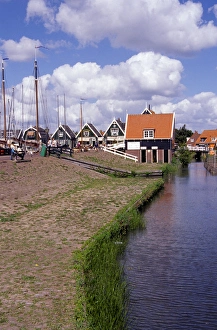 Europe, Netherlands, Amsterdam, Marken. Typical town buildings and canal, charming Europe, Netherlands, Amsterdam, Marken. Typical town buildings and canal, charming