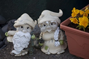 Fanciful troll figures by a flower box at the entrance to an Icelandic home Fanciful troll figures by a flower box at the entrance to an Icelandic home
