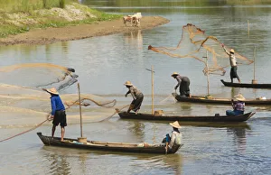 Fishermen fishing on the river, Bago, Bago Region, Myanmar Fishermen fishing on the river, Bago, Bago Region, Myanmar