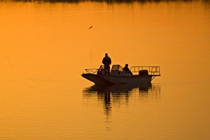 Fishing at sunset in north Texas, winter on Lake Arrowhead, USA Fishing at sunset in north Texas, winter on Lake Arrowhead, USA
