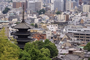 The five-tiered pagoda of To-ji, the tallest in Japan, looks out over the modern city of The five-tiered pagoda of To-ji, the tallest in Japan, looks out over the modern city of