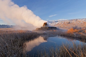 Fly Geyser with snow capped Granite Range in the Black Rock Desert near Gerlach, Nevada Fly Geyser with snow capped Granite Range in the Black Rock Desert near Gerlach, Nevada
