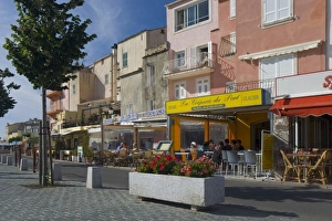 France, Corsica. Waterfront cafes and apartments in St. Florent France, Corsica. Waterfront cafes and apartments in St. Florent