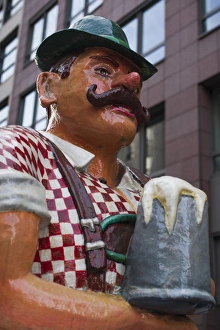 Germany, Berlin, Mitte, Friendrichstrasse, statue of large Bavarian man with beer stein Germany, Berlin, Mitte, Friendrichstrasse, statue of large Bavarian man with beer stein