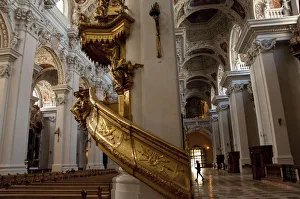 Germany, Passau. St. Stevens Cathedral, baroque interior. Gold spiral staircase Germany, Passau. St. Stevens Cathedral, baroque interior. Gold spiral staircase