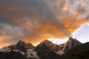 Prints of god rays, Crepuscular rays, clouds, and mountain peaks at sunset, Yerupaja, Grande and Chico to left, Jirishanca to right viewed from Lake Carhuacocha, Huayhuish Mountains and Circuit Images Dated 2009 July: Yerupaja, Grande and Chico Mountain Peaks Print