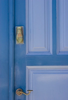 Greece, Santorini. Blue door with knocker in the shape of a hand Greece, Santorini. Blue door with knocker in the shape of a hand