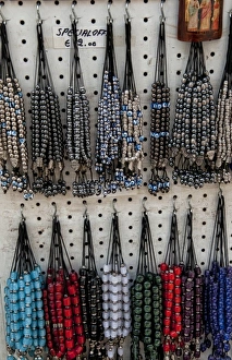 Greek souvenir beads on rack in downtown shopping area of Plaka, Athens, Greece Greek souvenir beads on rack in downtown shopping area of Plaka, Athens, Greece