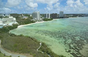 Guam USA Territory Tumon Bay hotels and beach from above with ocean beach and clouds Guam USA Territory Tumon Bay hotels and beach from above with ocean beach and clouds