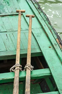 Ha Long Bay, Vietnam (UNESCO World Heritage Site). Close-up of oars on a green boat Ha Long Bay, Vietnam (UNESCO World Heritage Site). Close-up of oars on a green boat