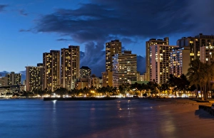 Hawaii Honolulu twilight of Waikiki Beach at night with colorful sky in Oahu Hawaii Honolulu twilight of Waikiki Beach at night with colorful sky in Oahu