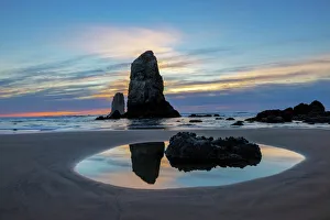 Haystack Rock Pinnacles at low tide in Cannon Beach, Oregon, USA Haystack Rock Pinnacles at low tide in Cannon Beach, Oregon, USA