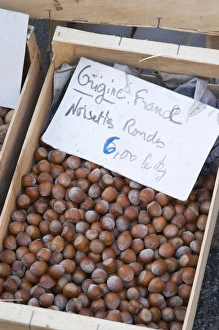 Hazelnut nuts for sale at a market stall at the market in Bergerac for 6 euro per kilo Hazelnut nuts for sale at a market stall at the market in Bergerac for 6 euro per kilo
